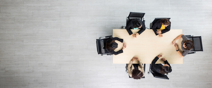 Top View Of Meeting Conference Wooden Table With Six Executives Businesswomen Sitting On Each Chairs Discussing And Talking Business In Team Work In Meeting Room