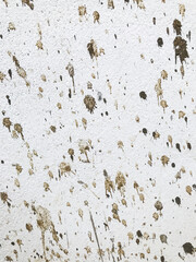 white wall is splashed with cement. texture background