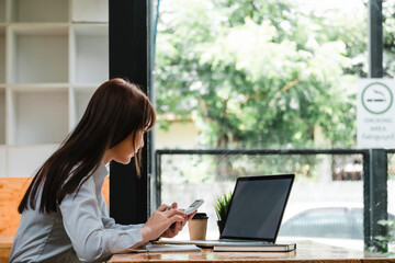Business accounting concept, Business woman using calculator with computer laptop, budget and loan paper in office