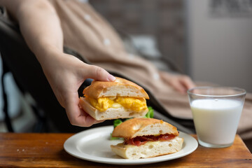 Obraz na płótnie Canvas Home made focaccia hot sub with bacon and egg