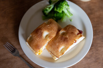 Home made focaccia hot sub with bacon and egg