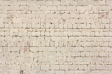 White brick wall.Brick background.The brick wall of the old building is painted white.