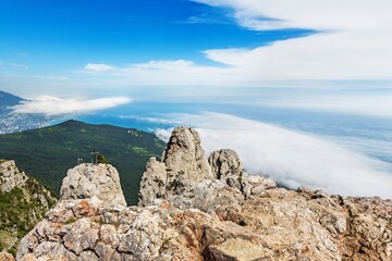 Big stone mountain with clouds and sky