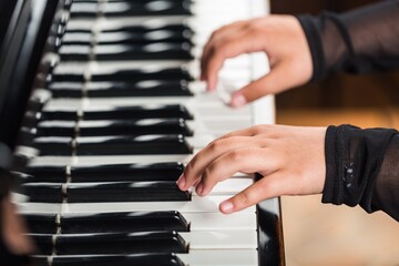Beautiful male pianist hand on piano key