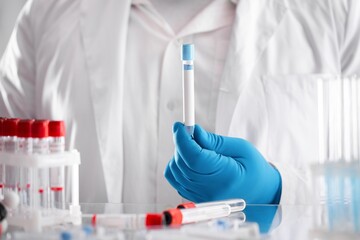 A covid-19 vaccine. Doctor's hand holds a bottle with a coronavirus vaccine