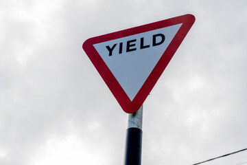 Yield Sign, traffic sign indicating traffic to yield to oncoming traffic at road junction or intersection