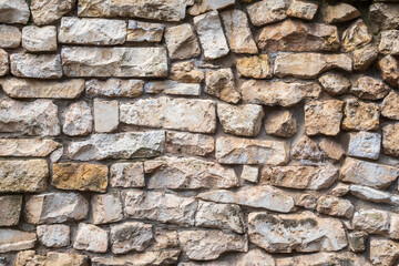 Backgrounds of the old fortress wall. Background of vintage stone wall