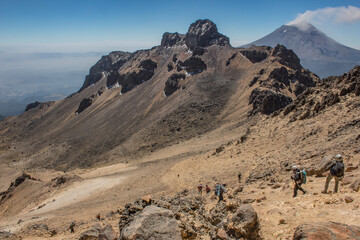 hikers going down volcano