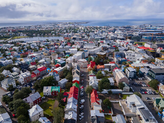 Naklejka premium Beautiful aerial view of the City of Reykjavik, with its majestic church and colorful houses and streets in Iceland