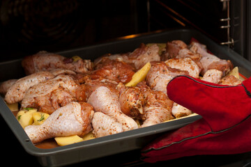 Cooking chicken meat with potatoes in the oven