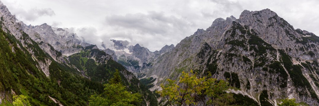 Panoramic View to the Impressive gorge, H&ouml;llentalklamm, Hell Valley Gorge near Grainau with rain and cloud sky. H&ouml;llental, Germany, Europe. Canyon near Zugspitze Mountain in Bavaria, Bavarian Alps