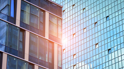 Fototapeta na wymiar Glass office building in city center on a background close up. Urban architecture of building business district.