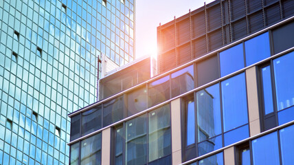 Obraz premium Glass office building in city center on a background close up. Urban architecture of building business district.