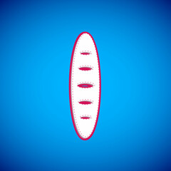 White French baguette bread icon isolated on blue background. Vector