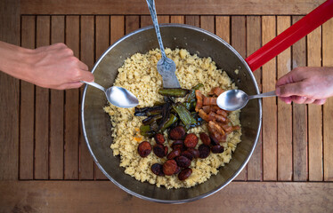 Traditional Spanish cuisine. Spanish Migas with chorizo sausage, fried green peppers and bacon