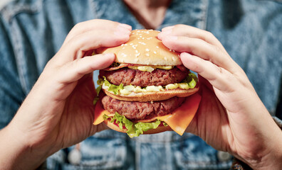 burger in human hands