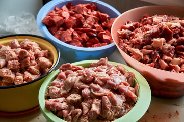 preparation of food for raw feeding. BARF food for dogs and cats. Packaging of food for animals.