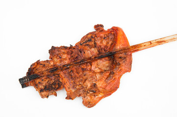 Smoky grilled chicken with bamboo stick isolated on white background.