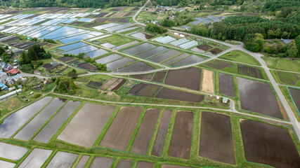 Freshly filled paddy fields on a gentle slope B