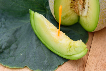 a piece of fresh green melon in dish