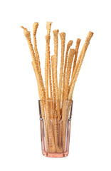 Delicious grissini sticks in glass on white background