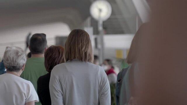 crowd waiting to catch the plane