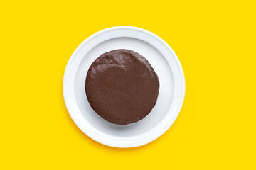 Chicken blood tofu in white plate on yellow background.