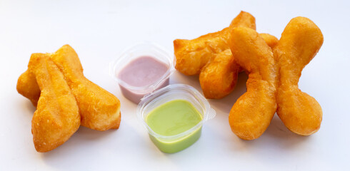 Deep-fried dough sticks or chinese bread sticks on white background.