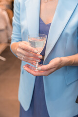 person holding glass of champagne