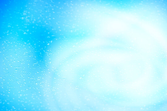 Abstract light blue background image with water droplets.