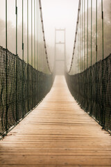 suspension bridge in the mist