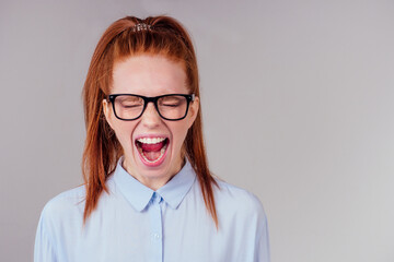 redhair ginger woman feeling angry and irritation studio background