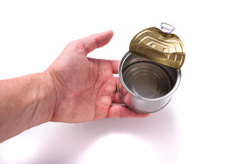 Man's hand held empty tin can over white background.