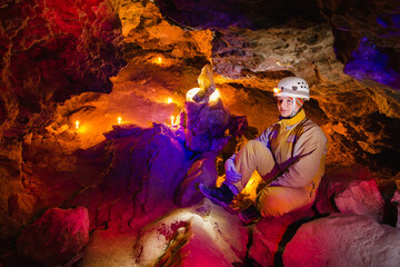Women explore the beautiful stone cave in Ukraine