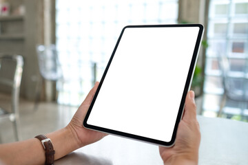 Fototapeta premium Mockup image of a woman holding digital tablet with blank white desktop screen