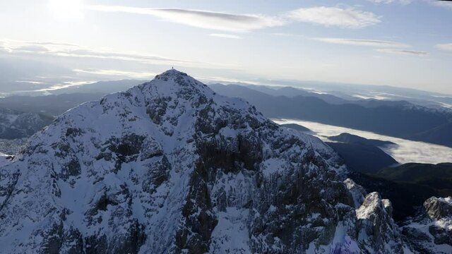 Aerial shot of mountain Triglav with snow on top