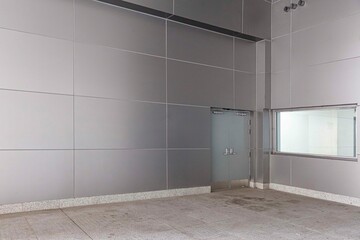 The room inside the large factory is empty