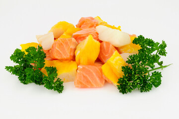 Mixed group of fresh raw salmon, cod and smoked haddock chunks prepared for a fish pie
