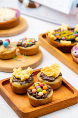 Martabak Mini or Martabak Mini Bangka with various Topping. The martabak mini bangka is made from a mixture of flour, eggs, sugar, baking soda, coconut milk and water.