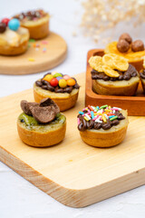 Martabak Mini or Martabak Mini Bangka with various Topping. The martabak mini bangka is made from a mixture of flour, eggs, sugar, baking soda, coconut milk and water.