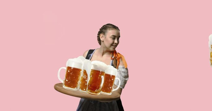The young sexy woman wearing a Bavarian dirndl with lot of beer mugs over color traditional background. Pretty girl catching glasses on a tray. The celebration, oktoberfest, festival, party concept.