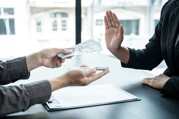 Close up of man employee offering bribe money and pen to businessman to signing the contract to joint engage