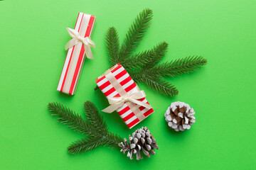 Christmas decorations and fir tree branch and gift boxon dark table. Top view frame with copy space