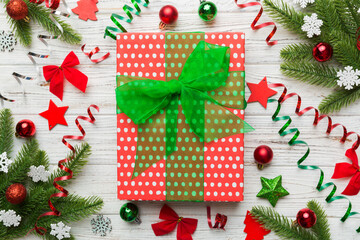 Fototapeta na wymiar Christmas composition. Gifts box with new year decorations on colored background. Christmas, winter, new year concept. Flat lay, top view, copy space