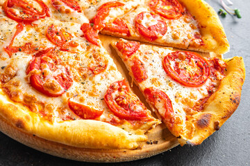 pizza margarita tomato, cheese, tomato sauce, dough Italian food fresh portion ready to eat meal snack on the table copy space food background rustic. top view