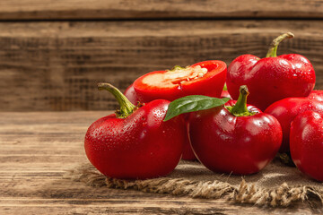 Ripe red round peppers on a vintage sackcloth napkin