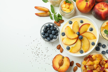 Concept of healthy food with peach yogurt and ingredients on white background