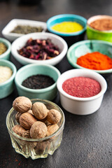 different types spices seasoning mix pungent and spicy herbs, ground spice fresh portion ready to eat meal snack on the table copy space food background rustic top view