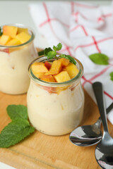Concept of healthy food with peach yogurt, close up