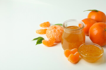 Mandarin jam and ingredients on white background